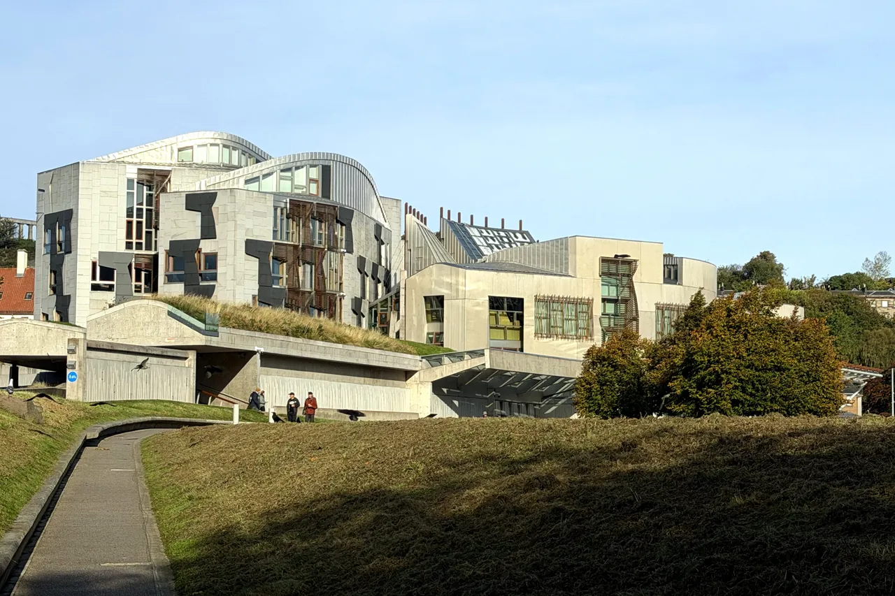 A path across a grassy slope towards the Scottish Parliament building